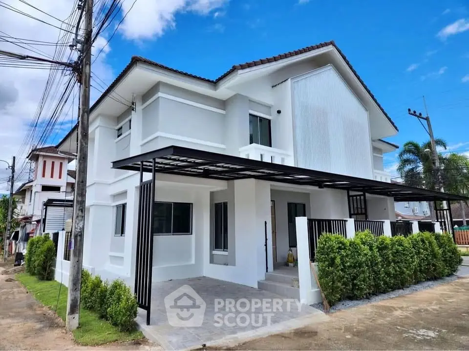 Modern two-story house with white facade and spacious driveway