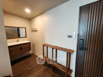 Modern bathroom with wooden accents and sleek design