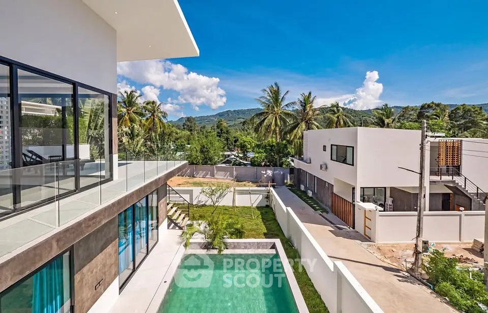 Stunning modern villa with private pool and lush mountain views, perfect for luxury living.