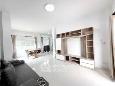 Spacious modern living room with sleek furniture and natural light