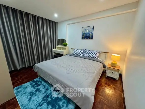 Cozy bedroom with modern decor and stylish furnishings, perfect for relaxation.