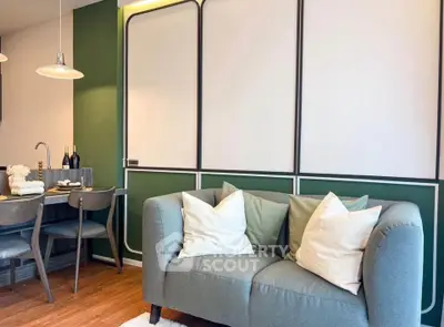 Stylish living room with modern decor and cozy seating in a contemporary apartment.