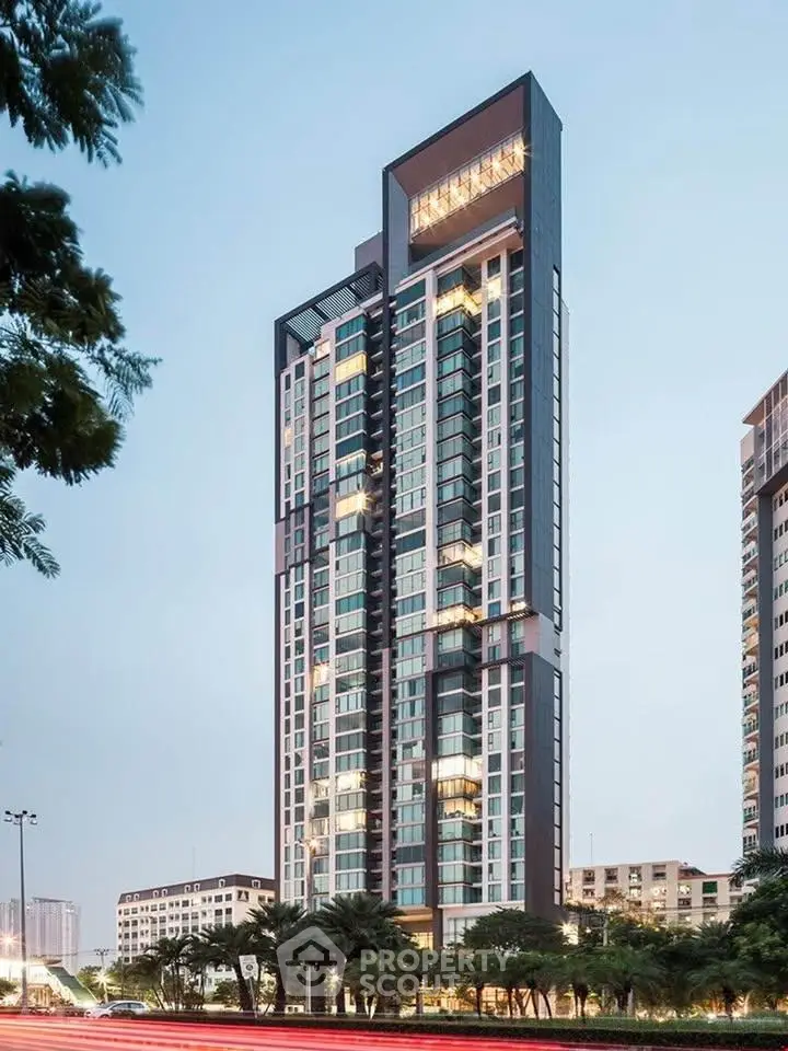 Stunning modern high-rise building with sleek design and lush surroundings, perfect for urban living.