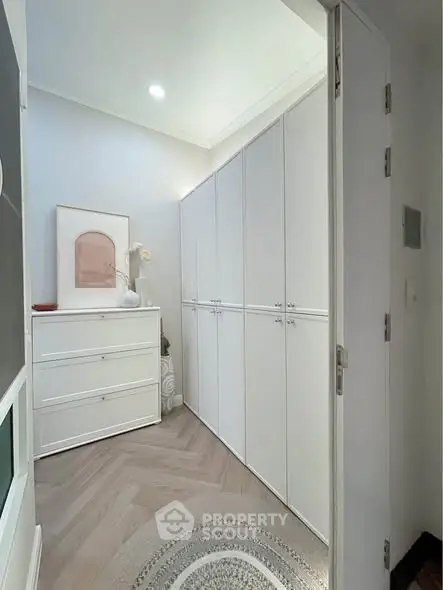 Elegant walk-in closet with ample storage and stylish decor