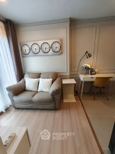 Stylish living room with cozy sofa and elegant study corner