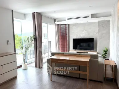 Spacious modern living room with large windows and stylish decor
