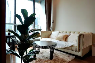 Stylish living room with plush sofa and city view, perfect for urban living.