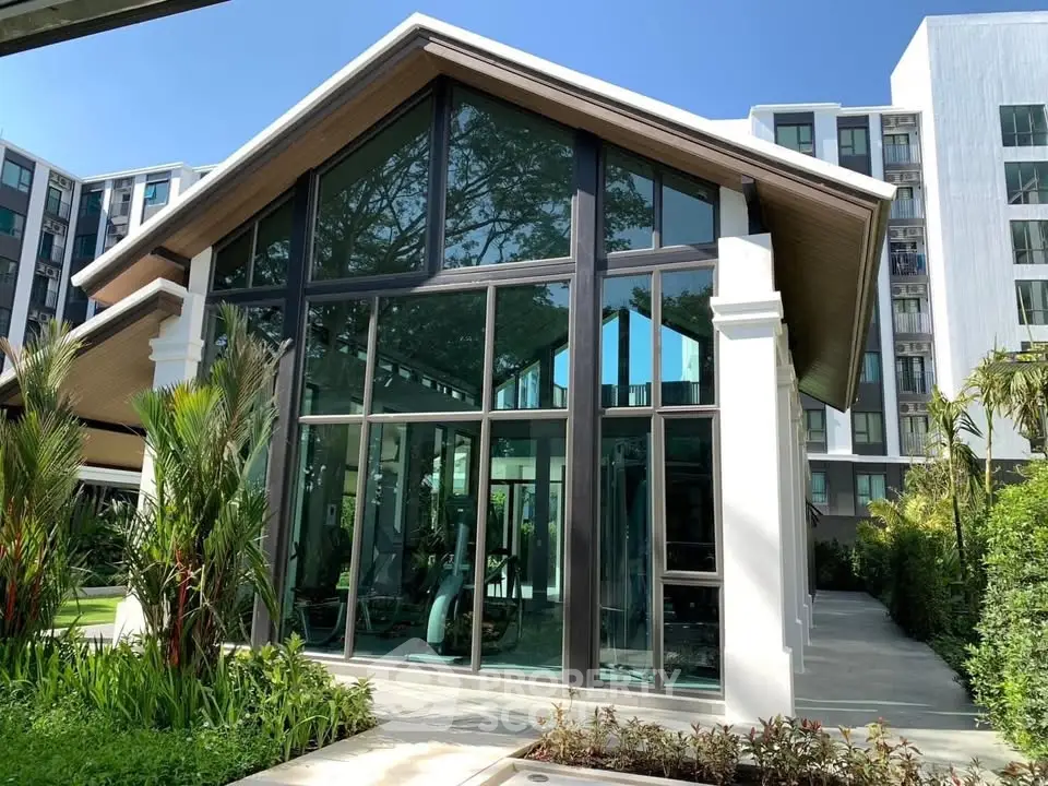 Modern gym facility with glass facade in upscale residential complex