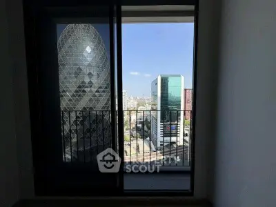 Stunning cityscape view from modern apartment balcony with iconic architecture.