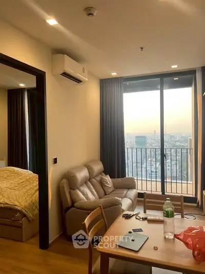 Modern apartment living room with city view and cozy furnishings
