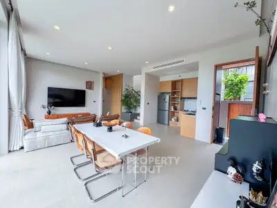 Spacious modern living room with open kitchen and stylish decor