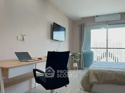 Modern bedroom with workspace and balcony view in urban apartment