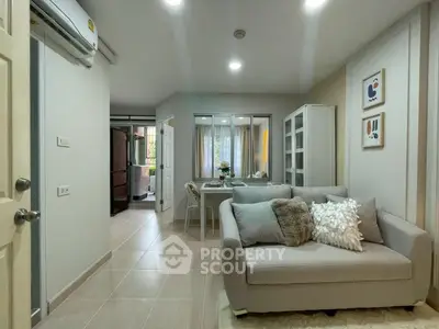 Modern living room with cozy sofa and dining area in stylish apartment