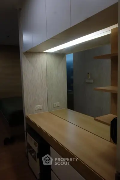 Modern interior with sleek wooden desk and mirror in cozy apartment