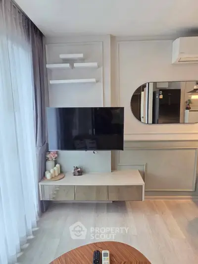 Modern living room with wall-mounted TV and stylish decor