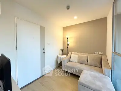 Cozy living room with beige sofa and modern floor lamp