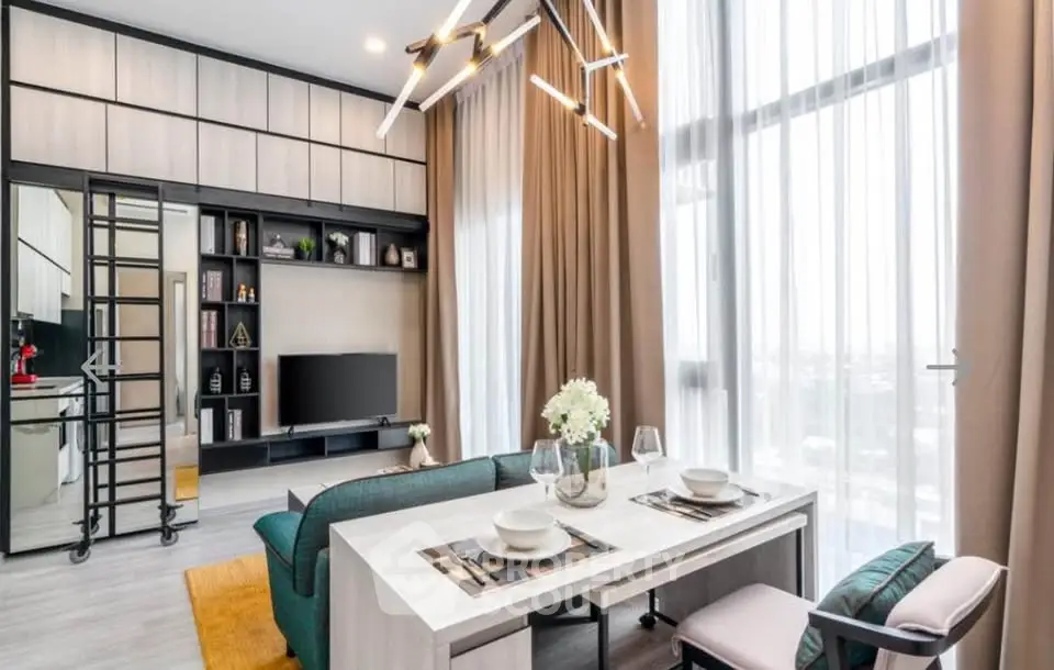 Modern living room with stylish decor and large windows offering natural light