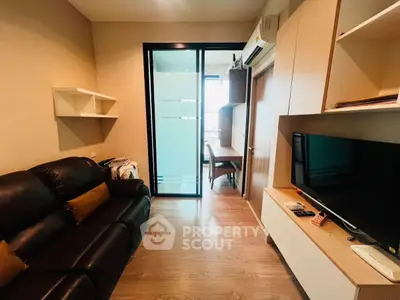 Modern living room with sleek furniture and glass partition, perfect for urban living.