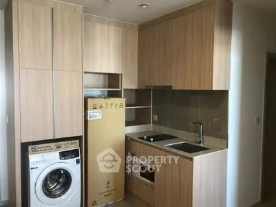 Modern kitchen with wooden cabinetry, built-in appliances, and sleek design.