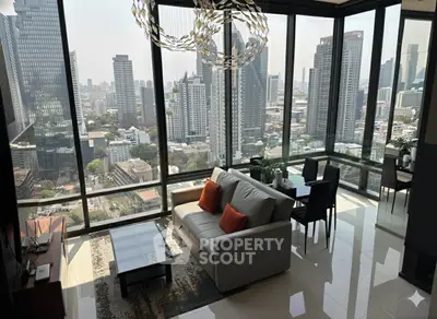 Stunning high-rise living room with panoramic city views and modern decor.