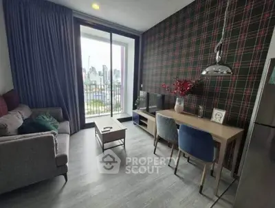 Modern living room with city view, stylish decor, and cozy seating area.
