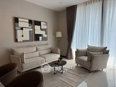 Elegant living room with modern furniture and large windows