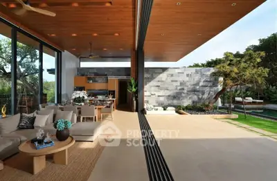 Luxurious open-plan living room with seamless indoor-outdoor flow and modern design