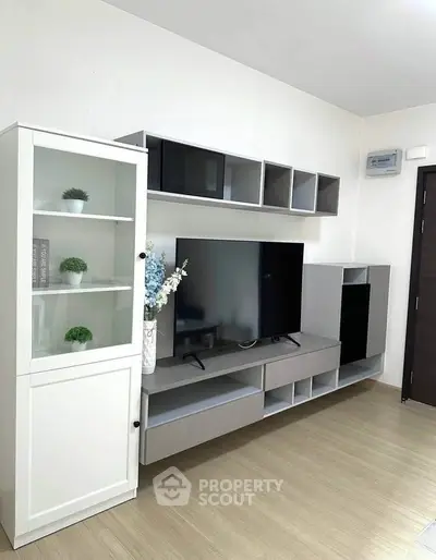 Modern living room with sleek TV unit and stylish shelving, perfect for contemporary home decor.