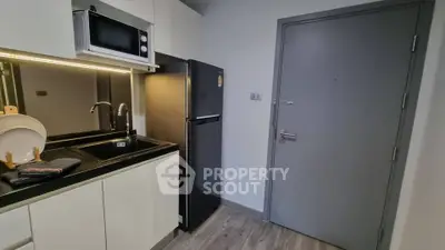Modern kitchen with sleek appliances and stylish cabinetry
