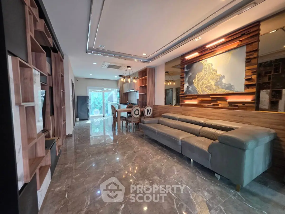 Luxurious modern living room with sleek marble flooring and stylish decor