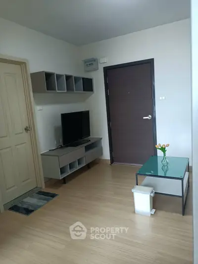 Modern living room with sleek furniture and wooden flooring