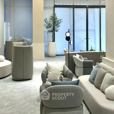 Luxurious modern living room with elegant furniture and large windows