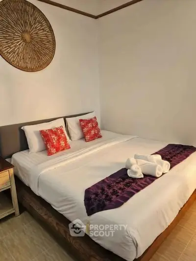 Cozy bedroom with elegant decor and comfortable bedding, perfect for relaxation and rest.