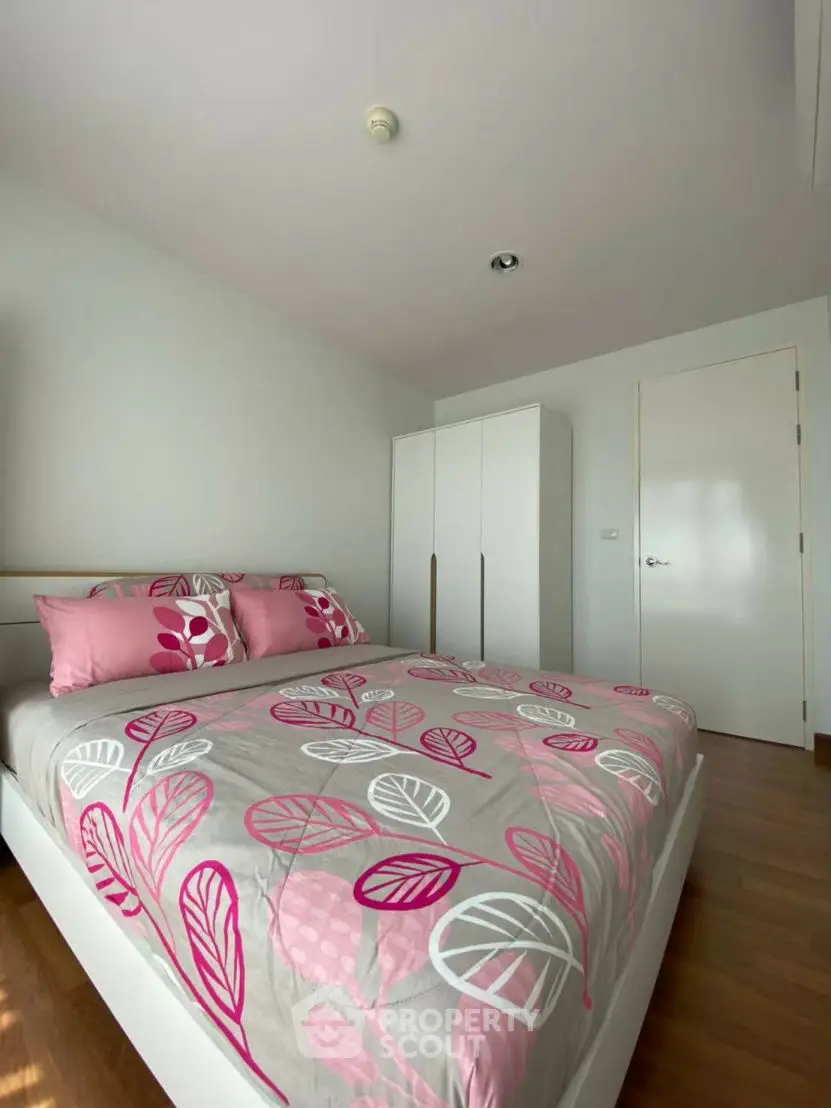 Bright bedroom with modern decor and stylish pink bedding