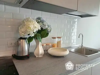 Modern kitchen with sleek countertop and stylish backsplash