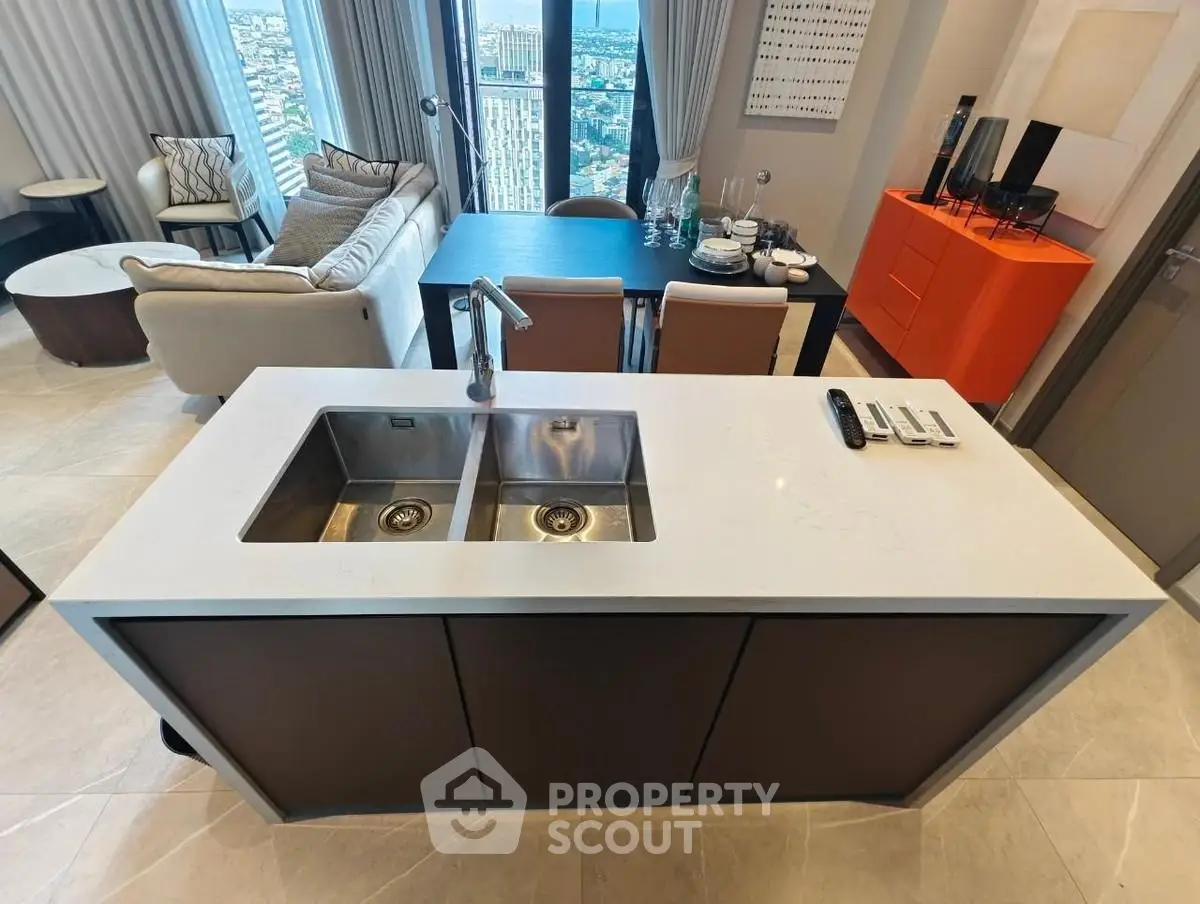 Modern open-plan living room with city view and stylish kitchen island