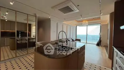 Luxurious open-layout kitchen with island and stunning view, perfect for modern living.