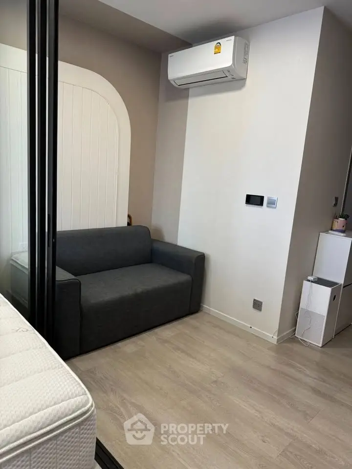 Modern living room with sleek air conditioning and minimalist furniture design.