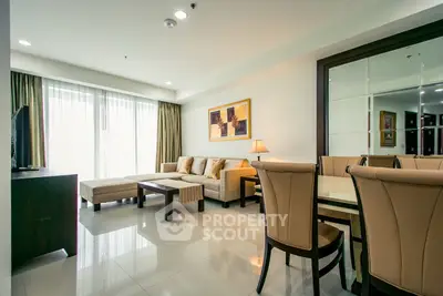 Spacious living room with elegant decor and large windows for natural light.