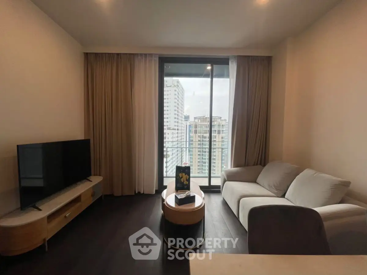 Modern living room with balcony view in high-rise apartment
