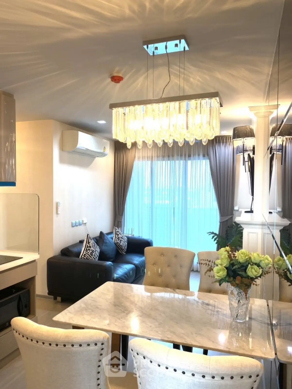 Luxurious modern living room with elegant chandelier and stylish furniture