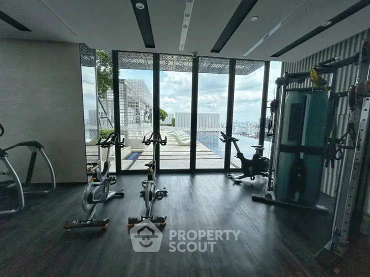 Modern gym with panoramic city view and state-of-the-art equipment