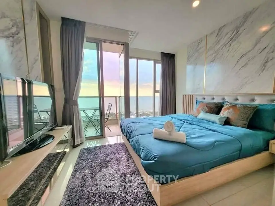 Luxurious bedroom with stunning ocean view and modern decor