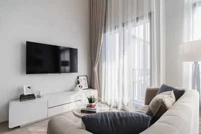 Modern living room with sleek TV setup and elegant decor