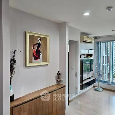 Stylish modern living room with elegant decor and large windows offering natural light.
