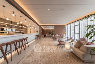 Luxurious modern living room with open layout and stylish bar area, featuring elegant lighting and floor-to-ceiling windows.