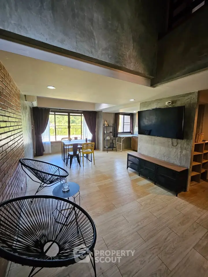 Spacious modern living room with large windows and stylish decor