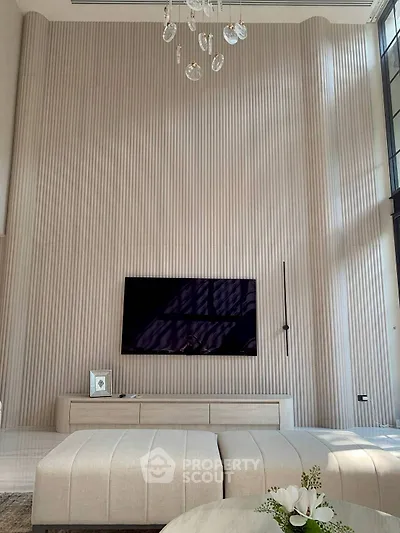 Luxurious modern living room with high ceilings and elegant decor