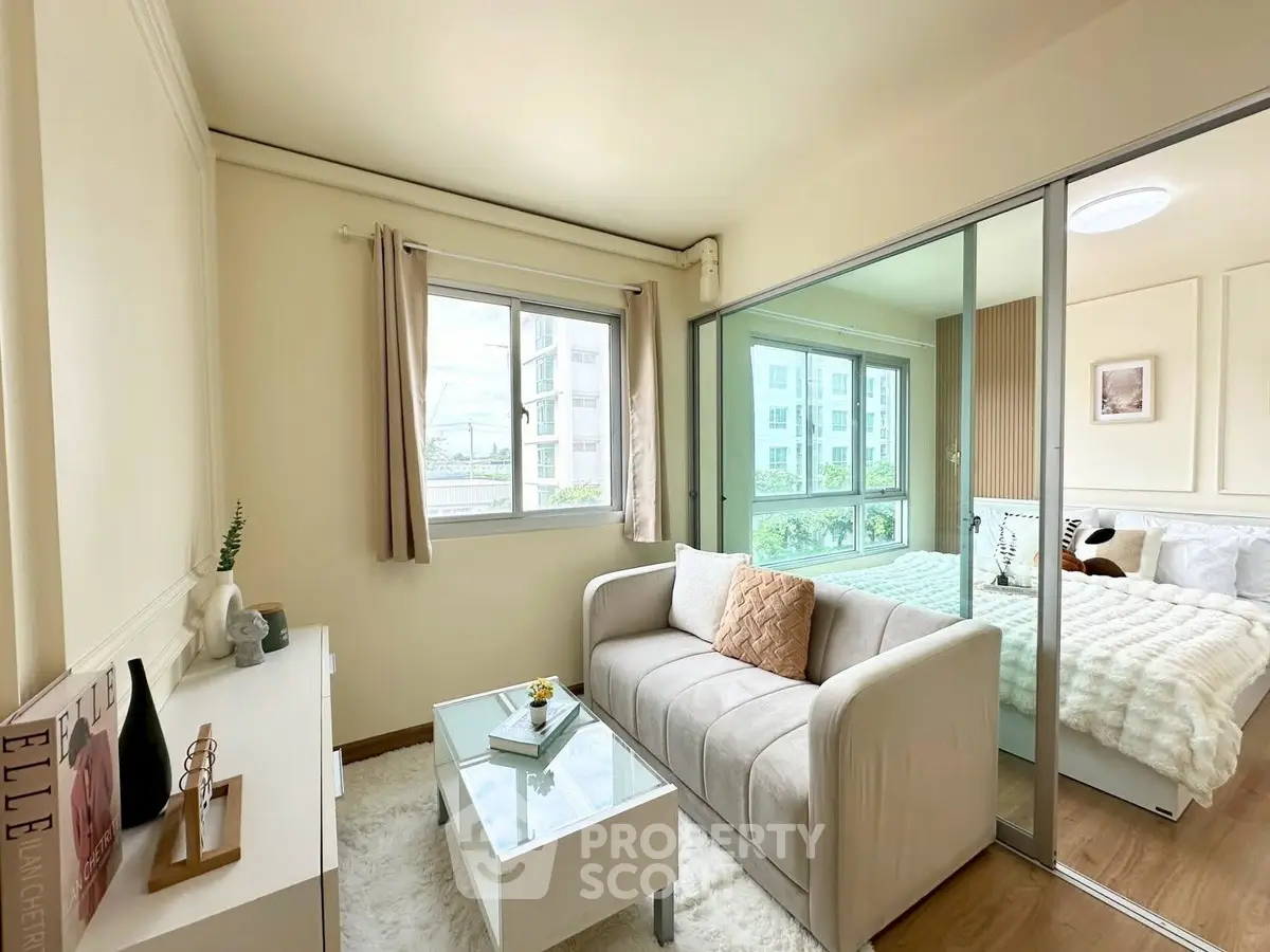 Chic living room with cozy sofa and large window in modern apartment