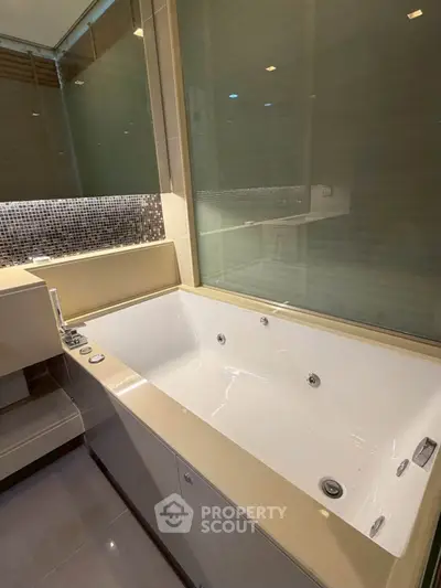 Luxurious bathroom with modern bathtub and elegant fixtures, perfect for relaxation and comfort.